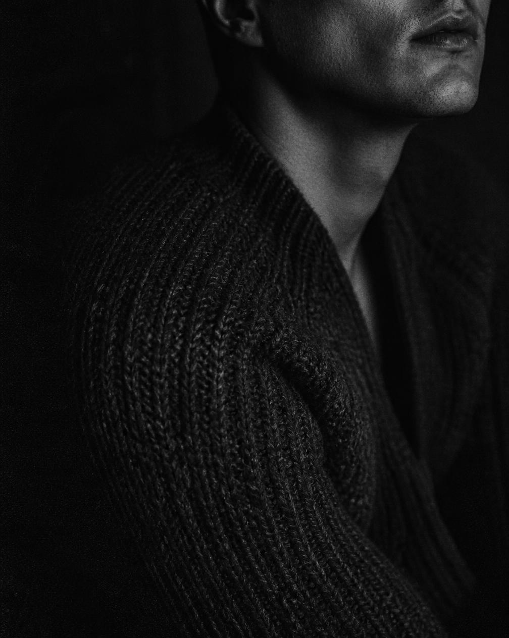 Editorial portrait fragment in heavyweight charcoal knit